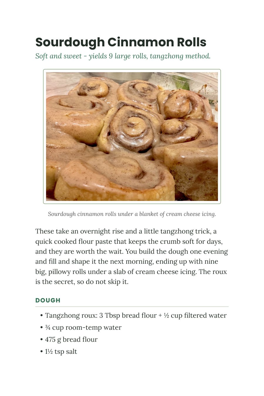 Book page for Sourdough Cinnamon Rolls with a photo of nine iced rolls fresh from the pan